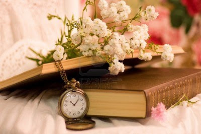 antique-pocket-watch-opened-old-books-and-flowers.jpg