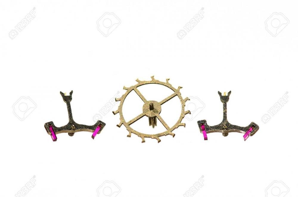 79873705-watch-parts-two-vintage-metallic-pallet-forks-and-escape-wheel-on-white-background.jpg